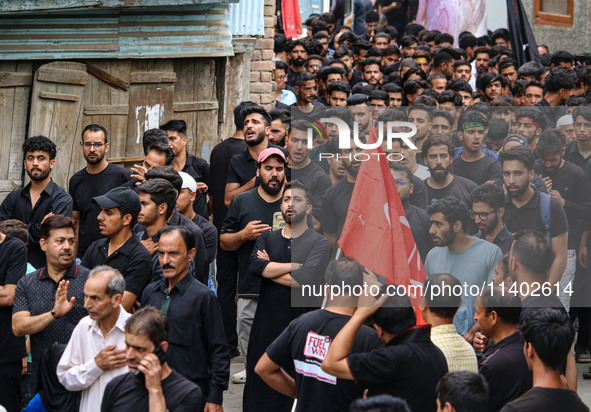 Shiite Muslim mourners are taking part in a Muharram procession on the fifth day of Ashura, in Srinagar, Jammu and Kashmir, on July 12, 2024...