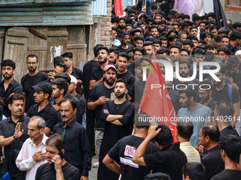 Shiite Muslim mourners are taking part in a Muharram procession on the fifth day of Ashura, in Srinagar, Jammu and Kashmir, on July 12, 2024...