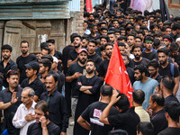 Shiite Muslim mourners are taking part in a Muharram procession on the fifth day of Ashura, in Srinagar, Jammu and Kashmir, on July 12, 2024...