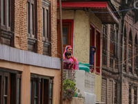 Kashmiri Muslims are watching a Muharram procession on the fifth day of Ashura, in Srinagar, Jammu and Kashmir, on July 12, 2024. (