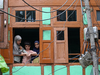 Children are watching a Muharram procession on the fifth day of Ashura, in Srinagar, Jammu and Kashmir, on July 12, 2024. (