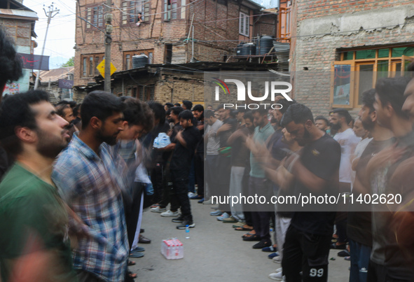 Shiite Muslim mourners are taking part in a Muharram procession on the fifth day of Ashura, in Srinagar, Jammu and Kashmir, on July 12, 2024...