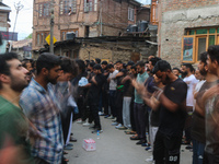 Shiite Muslim mourners are taking part in a Muharram procession on the fifth day of Ashura, in Srinagar, Jammu and Kashmir, on July 12, 2024...