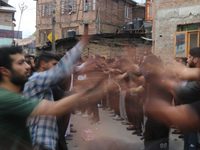 Shiite Muslim mourners are taking part in a Muharram procession on the fifth day of Ashura, in Srinagar, Jammu and Kashmir, on July 12, 2024...