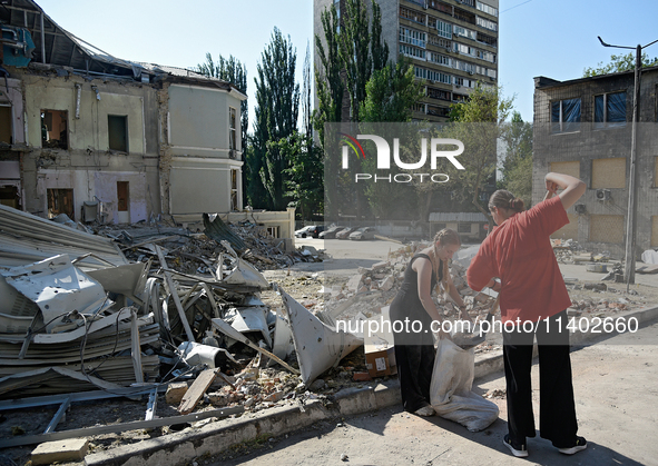 Volunteers are helping clean the premises of the Ohmatdyt National Specialized Children's Hospital destroyed by the Russian missile attack o...