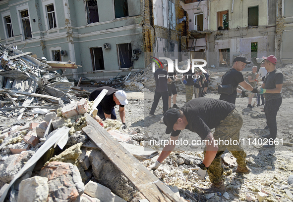 Volunteers are helping clean the premises of the Ohmatdyt National Specialized Children's Hospital destroyed by the Russian missile attack o...