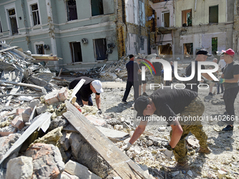 Volunteers are helping clean the premises of the Ohmatdyt National Specialized Children's Hospital destroyed by the Russian missile attack o...