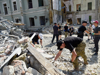 Volunteers are helping clean the premises of the Ohmatdyt National Specialized Children's Hospital destroyed by the Russian missile attack o...