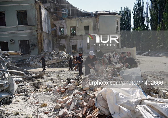 Volunteers are helping clean the premises of the Ohmatdyt National Specialized Children's Hospital destroyed by the Russian missile attack o...