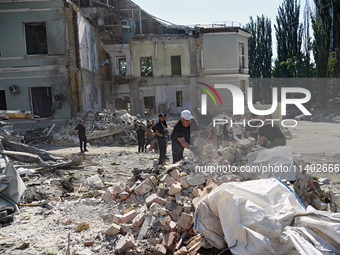 Volunteers are helping clean the premises of the Ohmatdyt National Specialized Children's Hospital destroyed by the Russian missile attack o...