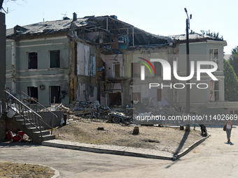 A building destroyed by the Russian missile attack on July 8 is being pictured on the premises of the Ohmatdyt National Specialized Children...