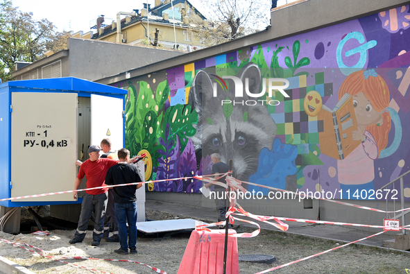 Workers are on the premises of the Ohmatdyt National Specialized Children's Hospital, devastated by the Russian missile attack on July 8, in...