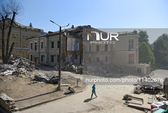 A building destroyed by the Russian missile attack on July 8 is being pictured on the premises of the Ohmatdyt National Specialized Children...