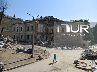 A building destroyed by the Russian missile attack on July 8 is being pictured on the premises of the Ohmatdyt National Specialized Children...