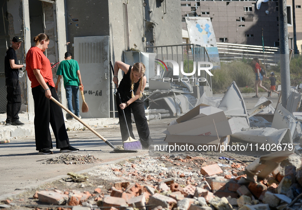 Volunteers are helping clean the premises of the Ohmatdyt National Specialized Children's Hospital destroyed by the Russian missile attack o...