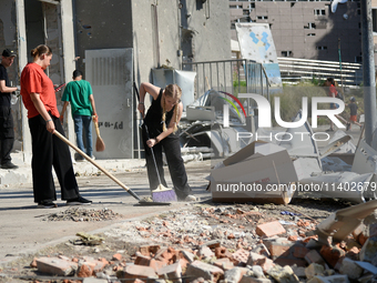 Volunteers are helping clean the premises of the Ohmatdyt National Specialized Children's Hospital destroyed by the Russian missile attack o...