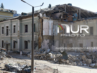 A building destroyed by the Russian missile attack on July 8 is being pictured on the premises of the Ohmatdyt National Specialized Children...