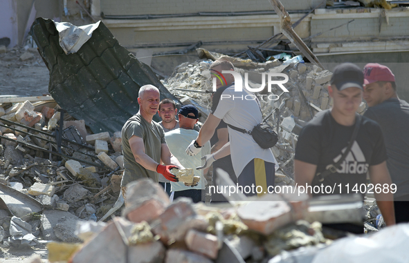 Volunteers are helping clean the premises of the Ohmatdyt National Specialized Children's Hospital destroyed by the Russian missile attack o...