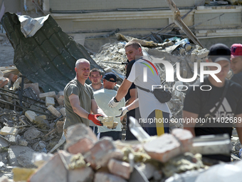 Volunteers are helping clean the premises of the Ohmatdyt National Specialized Children's Hospital destroyed by the Russian missile attack o...