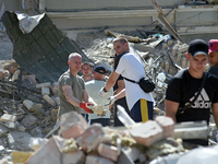 Volunteers are helping clean the premises of the Ohmatdyt National Specialized Children's Hospital destroyed by the Russian missile attack o...