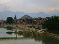 Residential houses are being seen on the banks of River Jhelum in Srinagar, Jammu and Kashmir, on July 12, 2024. (