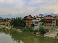 Residential houses are being seen on the banks of River Jhelum in Srinagar, Jammu and Kashmir, on July 12, 2024. (