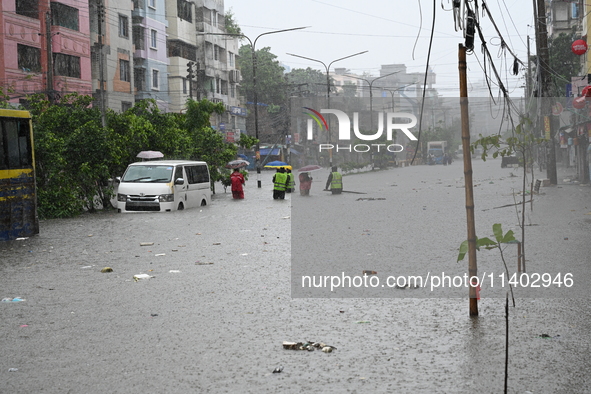 The drum of incessant rainfall woke the people of Dhaka city on Friday as a heavy monsoon shower poured down on the capital.

The rain, wh...