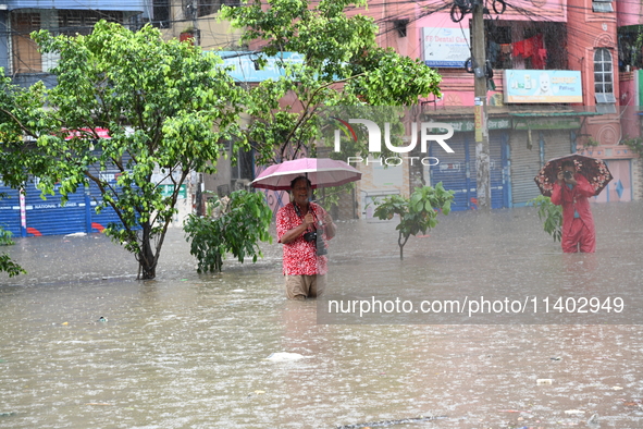 The drum of incessant rainfall woke the people of Dhaka city on Friday as a heavy monsoon shower poured down on the capital.

The rain, wh...