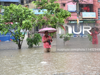 The drum of incessant rainfall woke the people of Dhaka city on Friday as a heavy monsoon shower poured down on the capital.

The rain, wh...