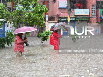 The drum of incessant rainfall woke the people of Dhaka city on Friday as a heavy monsoon shower poured down on the capital.

The rain, wh...