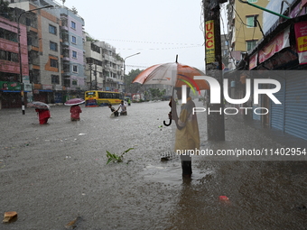 The drum of incessant rainfall woke the people of Dhaka city on Friday as a heavy monsoon shower poured down on the capital.

The rain, wh...