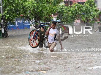 The drum of incessant rainfall woke the people of Dhaka city on Friday as a heavy monsoon shower poured down on the capital.

The rain, wh...