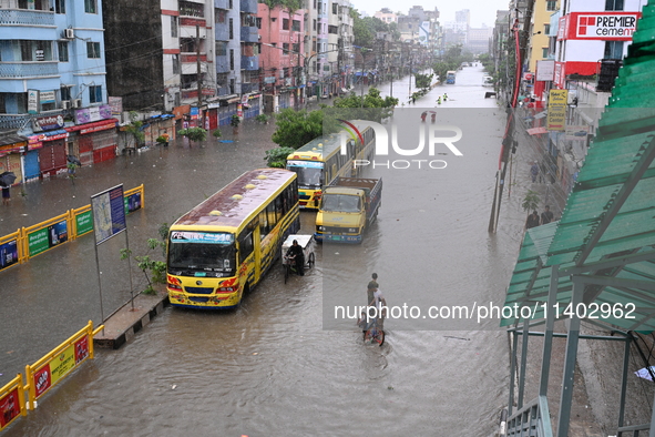 The drum of incessant rainfall woke the people of Dhaka city on Friday as a heavy monsoon shower poured down on the capital.

The rain, wh...