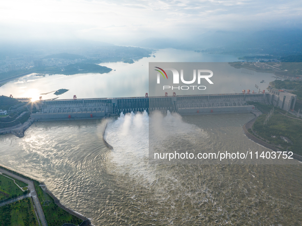 An aerial photo is showing the four holes of the Three Gorges Reservoir discharging flooding water in Yichang, China, on July 12, 2024. 