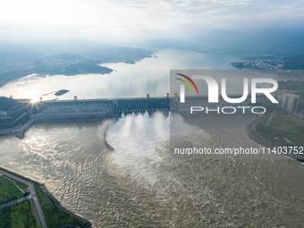 An aerial photo is showing the four holes of the Three Gorges Reservoir discharging flooding water in Yichang, China, on July 12, 2024. (