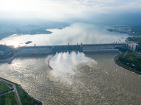 An aerial photo is showing the four holes of the Three Gorges Reservoir discharging flooding water in Yichang, China, on July 12, 2024. (