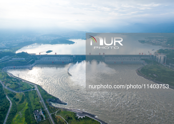 An aerial photo is showing the four holes of the Three Gorges Reservoir discharging flooding water in Yichang, China, on July 12, 2024. 