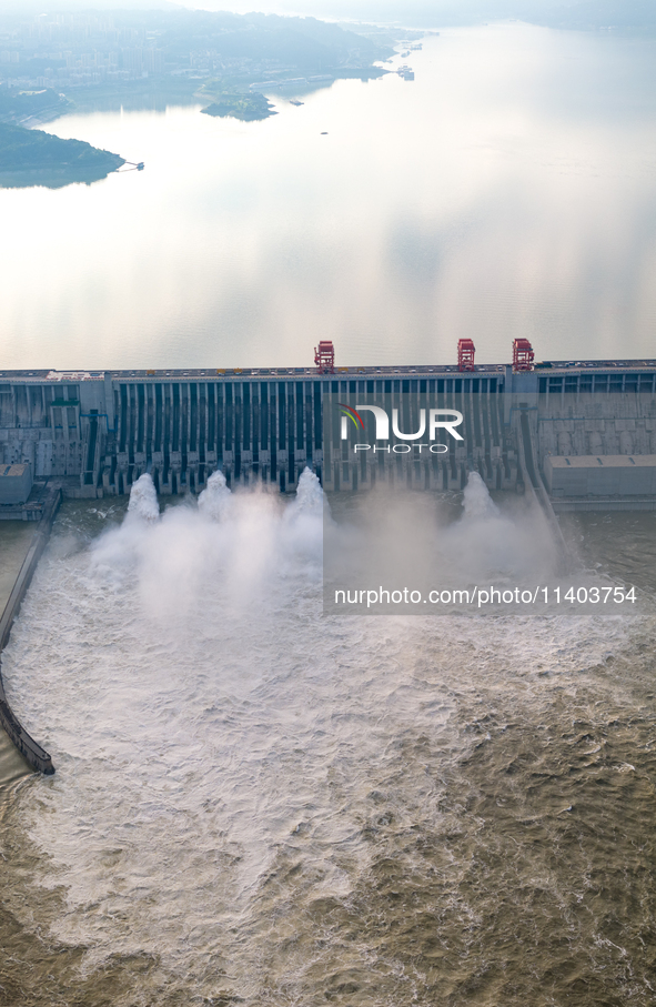 An aerial photo is showing the four holes of the Three Gorges Reservoir discharging flooding water in Yichang, China, on July 12, 2024. 