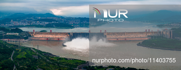 An aerial photo is showing the four holes of the Three Gorges Reservoir discharging flooding water in Yichang, China, on July 12, 2024. 