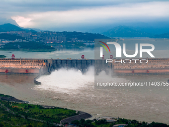 An aerial photo is showing the four holes of the Three Gorges Reservoir discharging flooding water in Yichang, China, on July 12, 2024. (