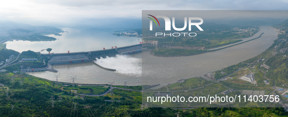 An aerial photo is showing the four holes of the Three Gorges Reservoir discharging flooding water in Yichang, China, on July 12, 2024. 