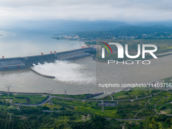 An aerial photo is showing the four holes of the Three Gorges Reservoir discharging flooding water in Yichang, China, on July 12, 2024. (