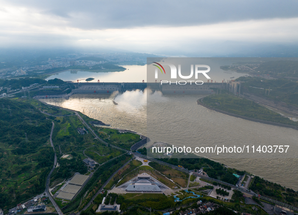 An aerial photo is showing the four holes of the Three Gorges Reservoir discharging flooding water in Yichang, China, on July 12, 2024. 