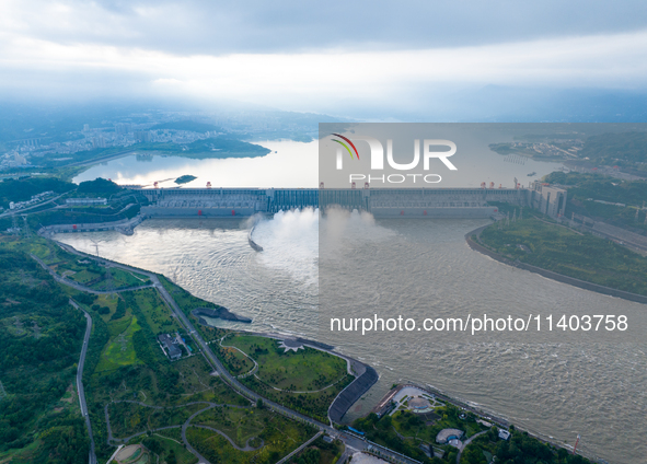 An aerial photo is showing the four holes of the Three Gorges Reservoir discharging flooding water in Yichang, China, on July 12, 2024. 