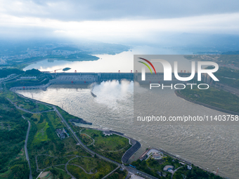 An aerial photo is showing the four holes of the Three Gorges Reservoir discharging flooding water in Yichang, China, on July 12, 2024. (