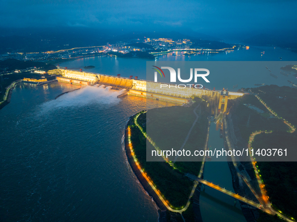 An aerial photo is showing the four holes of the Three Gorges Reservoir discharging flooding water in Yichang, China, on July 12, 2024. 