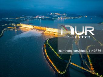 An aerial photo is showing the four holes of the Three Gorges Reservoir discharging flooding water in Yichang, China, on July 12, 2024. (