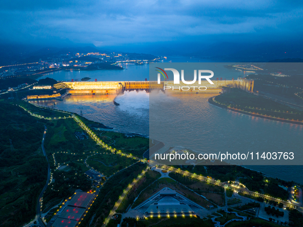 An aerial photo is showing the four holes of the Three Gorges Reservoir discharging flooding water in Yichang, China, on July 12, 2024. 