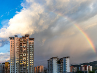 A photo is showing a rainbow over Nanchuan urban area in Chongqing, China, on July 12, 2024. (