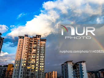 A photo is showing a rainbow over Nanchuan urban area in Chongqing, China, on July 12, 2024. (